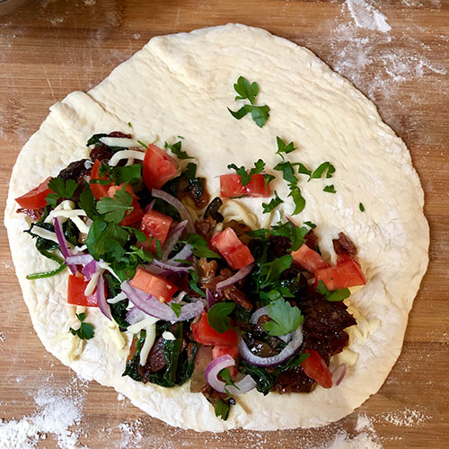 Add the contents to the Delicious Breakfast Calzones